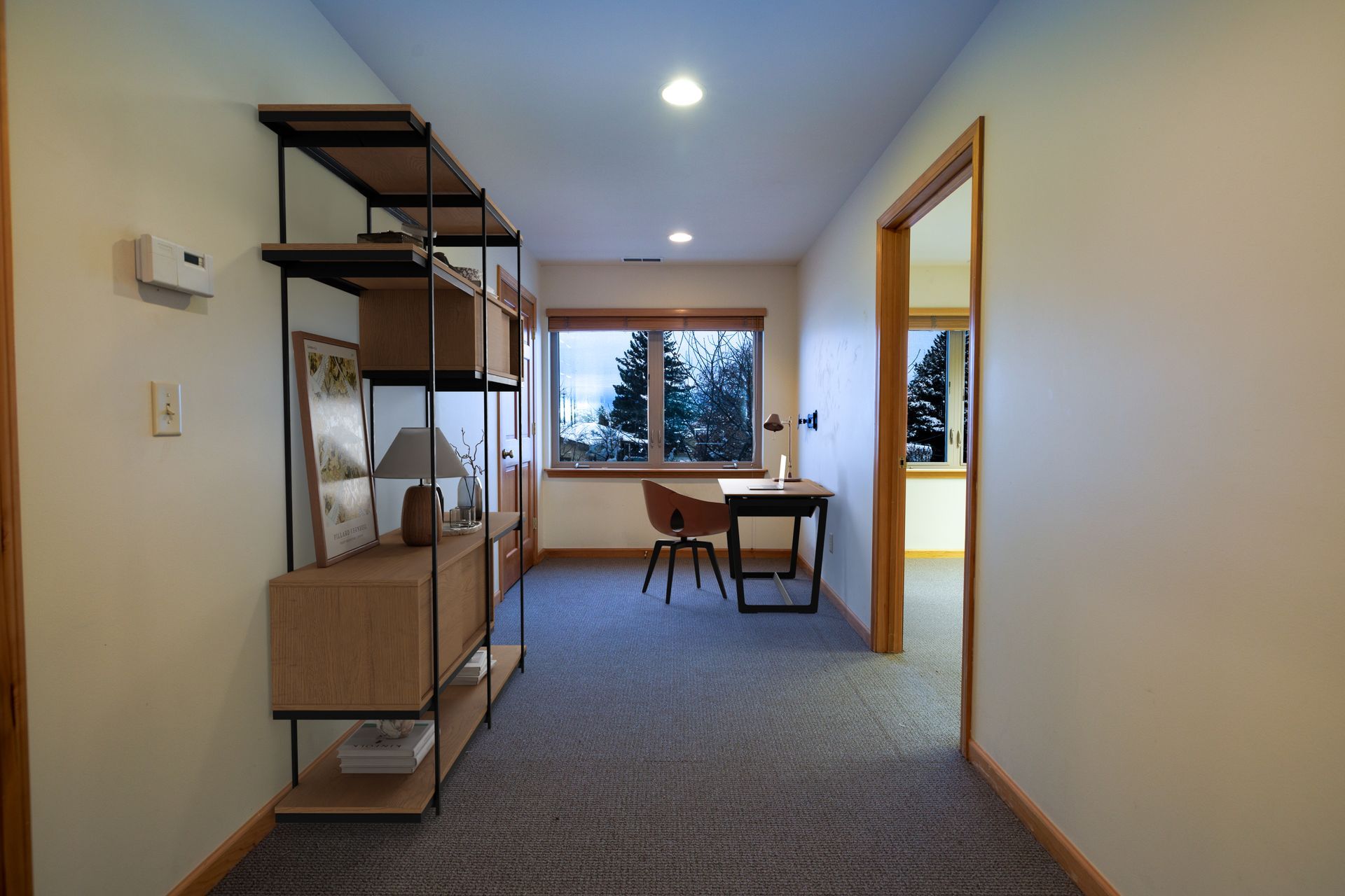 Private suite or conference room at 251 Edelweiss Bozeman featuring glass partitions and natural light