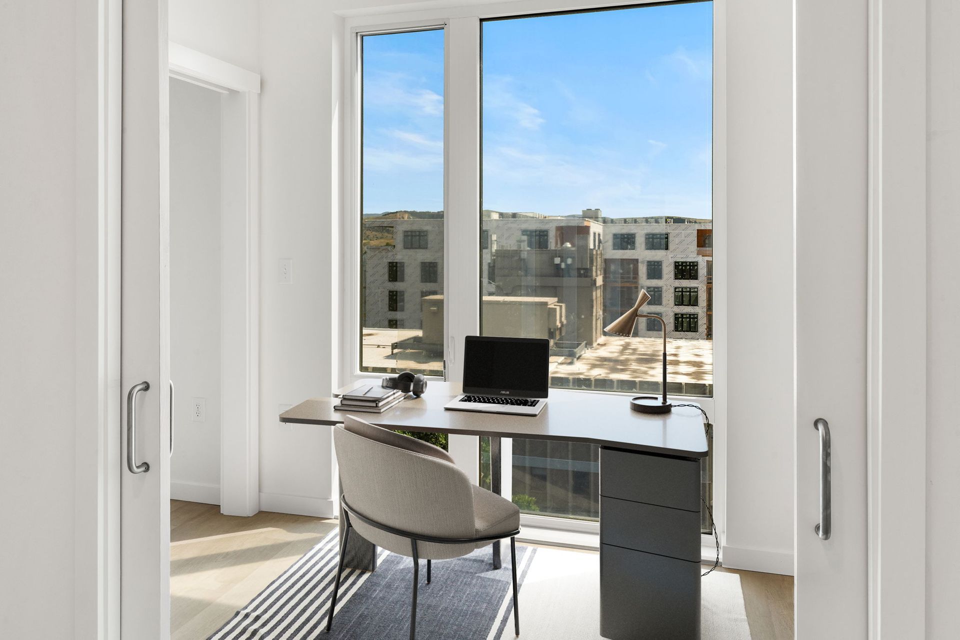 Bedroom at The Ives Bozeman with modern design, natural lighting, and mountain views