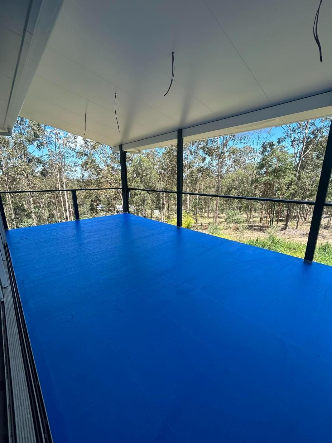 There is a Blue Floor in the Middle of The Room — Waterproofing Solutions in Toowoomba, QLD
