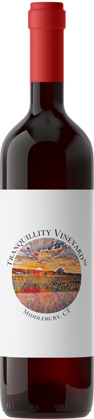 A bottle of wine with a white label and a red cap