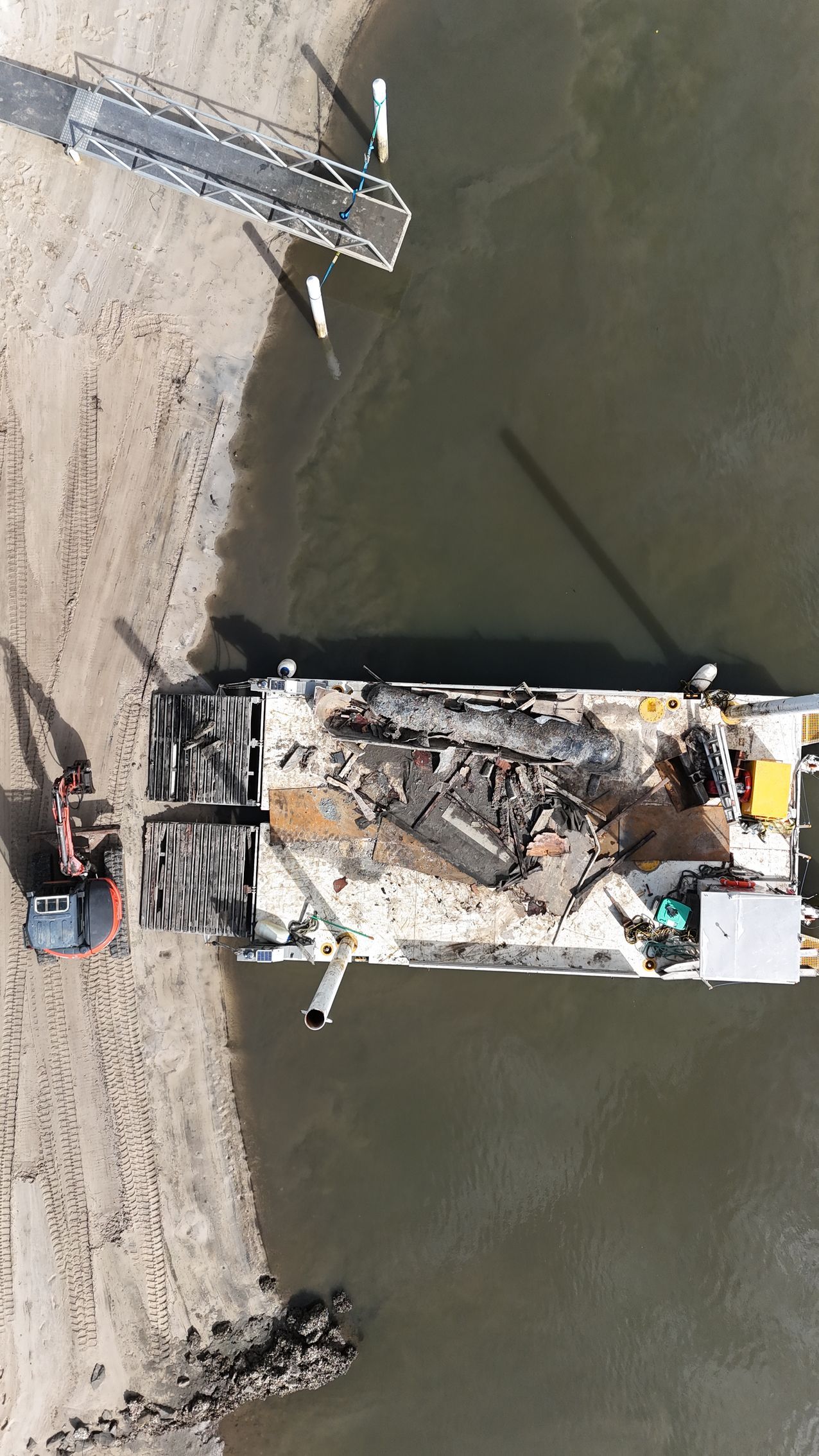 Aerial View of a Barge With Construction Debris — On Demand Diggers and Demolitions in Molendinar, QLD