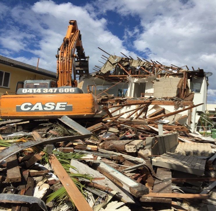 Case Excavator is Demolishing a Building — On Demand Diggers & Demolitions in Molendinar, QLD