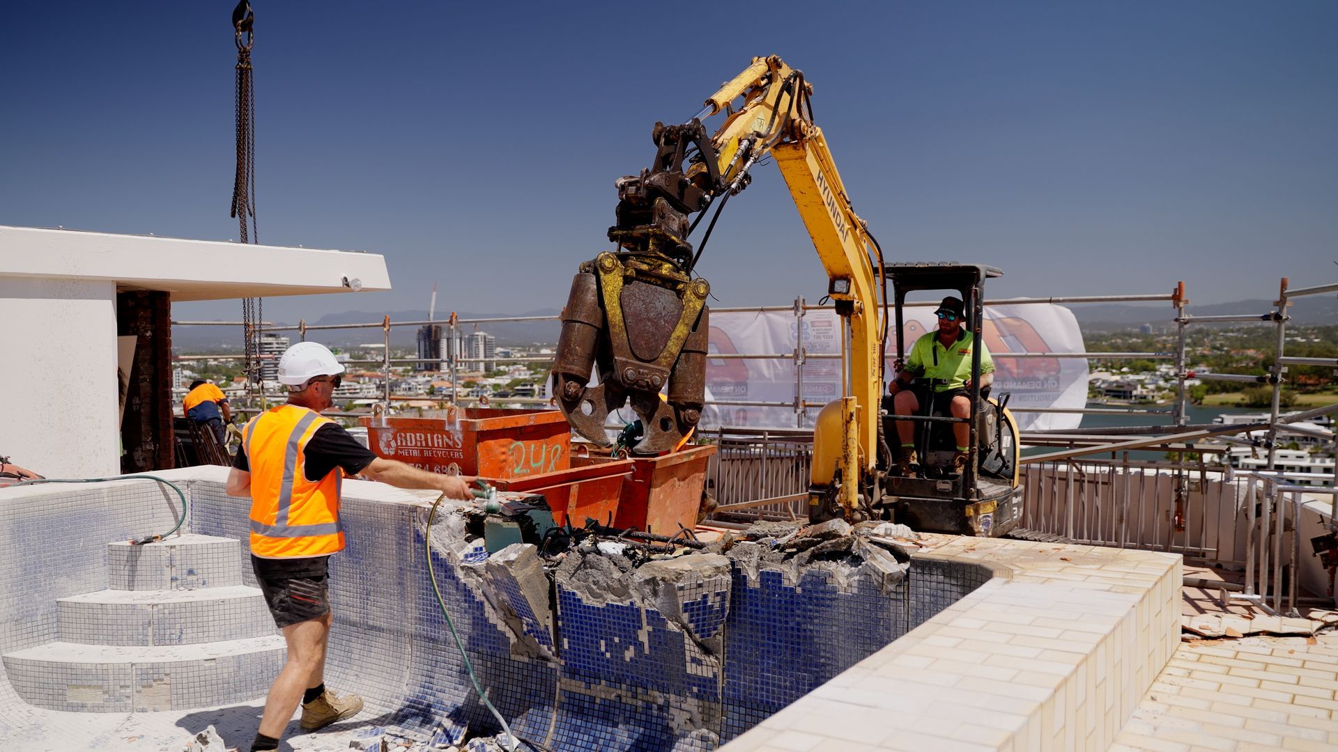 A Blue Boat is Sitting on a Sandy Beach — On Demand Diggers & Demolitions in Molendinar, QLD
