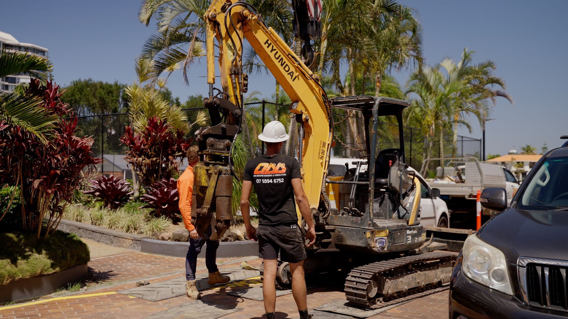 Yellow Excavator is Demolishing a Concrete Building — On Demand Diggers & Demolitions in Molendinar, QLD