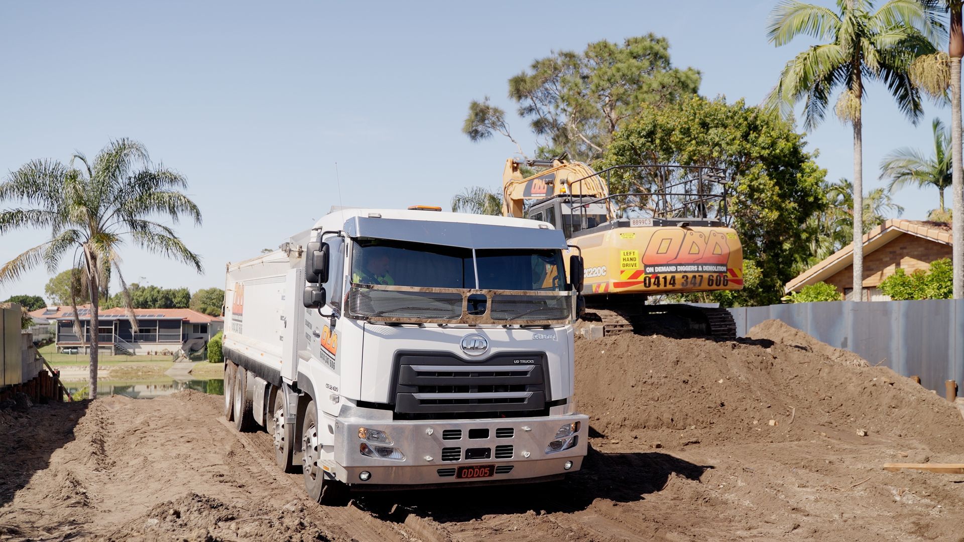 A Couple of Excavators Are Sitting on Top of a Pile of Dirt — On Demand Diggers & Demolitions in Northern, NSW