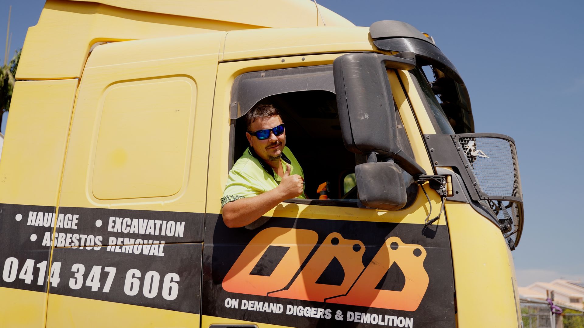 Bulldozer is Pouring Dirt Into a Pile — On Demand Diggers & Demolitions in Molendinar, QLD