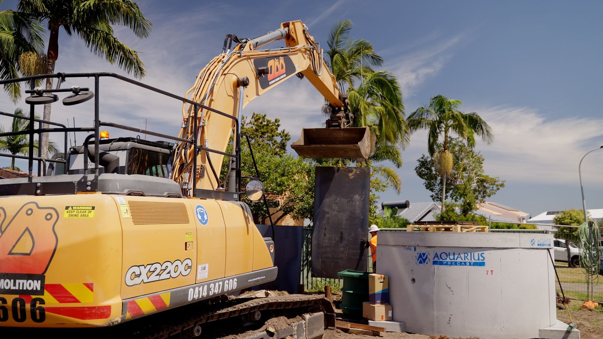 Large Bucket is Sitting in Front of a Building That is Being Demolished — On Demand Diggers & Demolitions in Regional, QLD