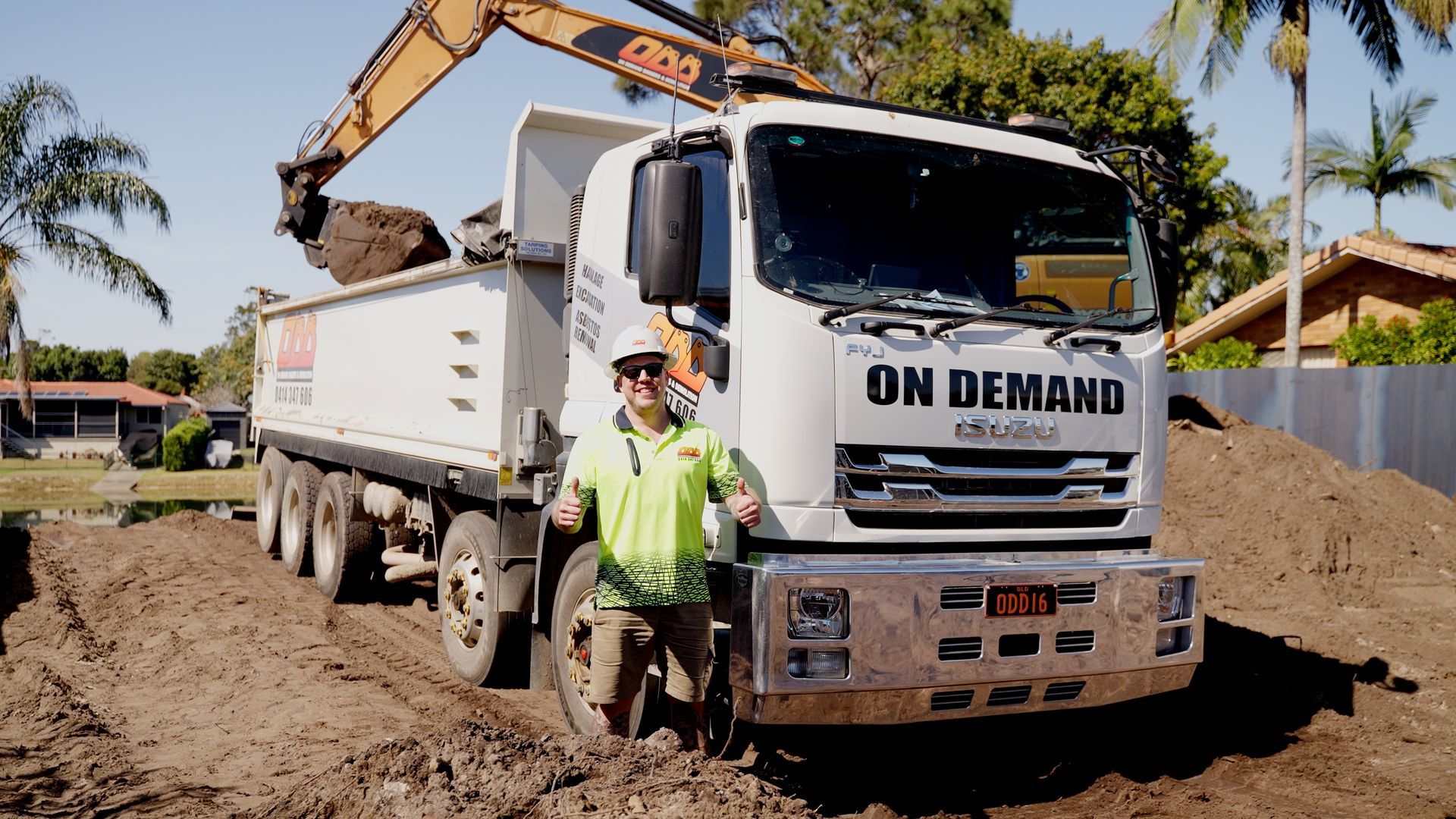 White Dump Truck Unloading Rocks — On Demand Diggers & Demolitions in Molendinar, QLD