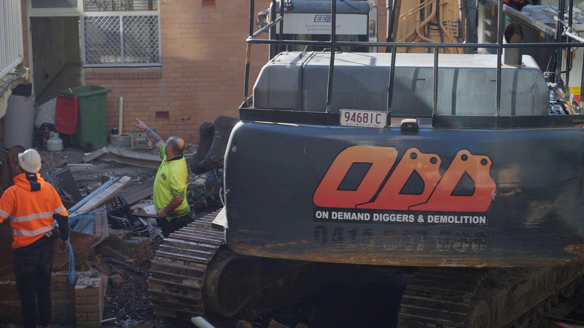 Large Yellow Excavator is Demolishing a Building — On Demand Diggers & Demolitions in Molendinar, QLD