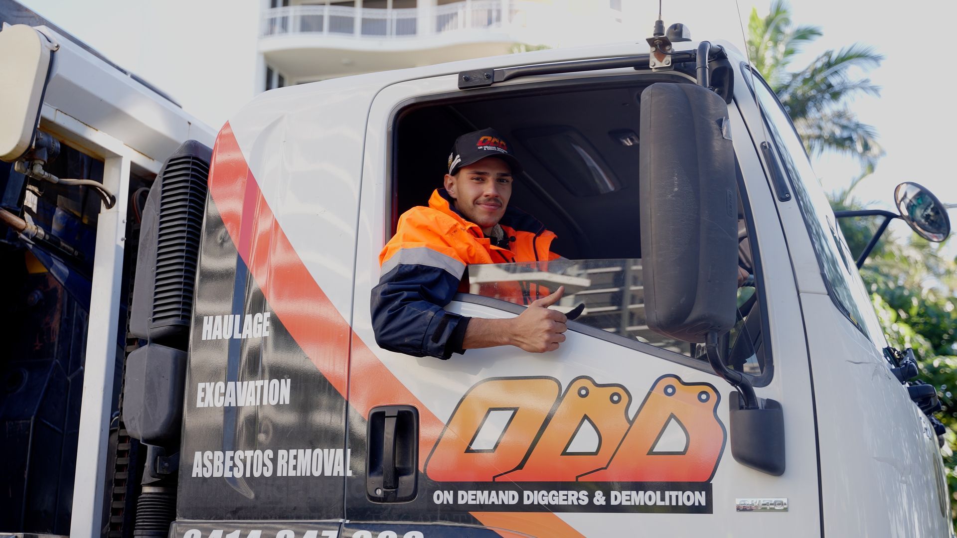 A Construction Worker Riding a Truck — On Demand Diggers & Demolitions in Molendinar, QLD 