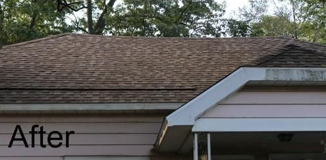 Brown roof of a house with white trim. The word 