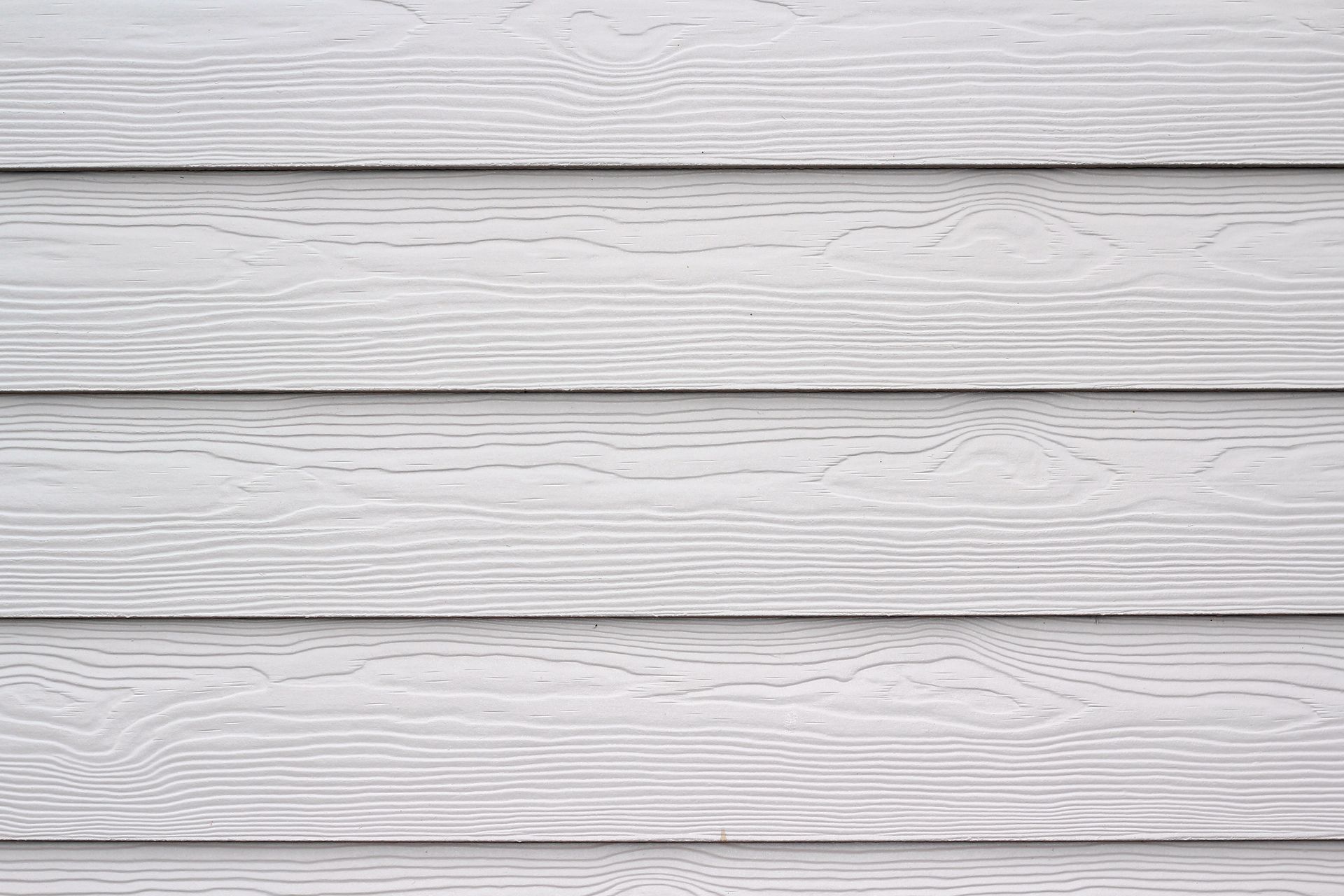 Gray, horizontal wood siding with visible wood grain texture.