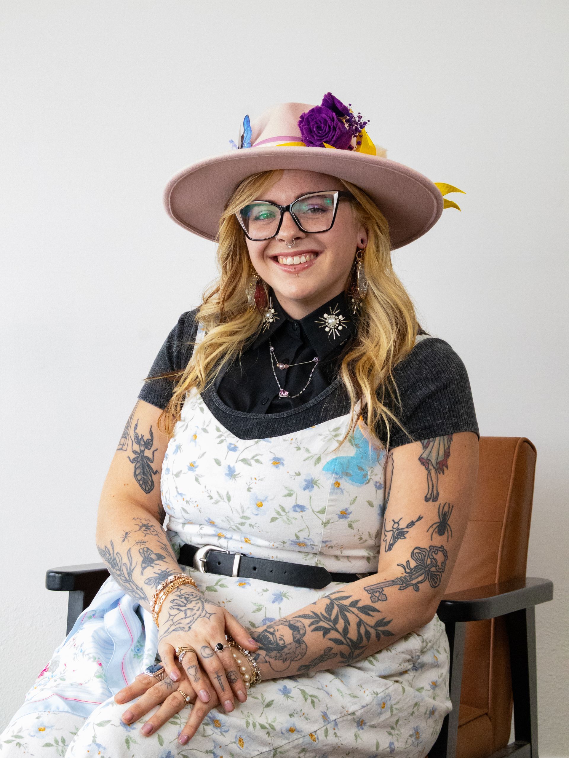 A large green house with a porch and a lot of windows