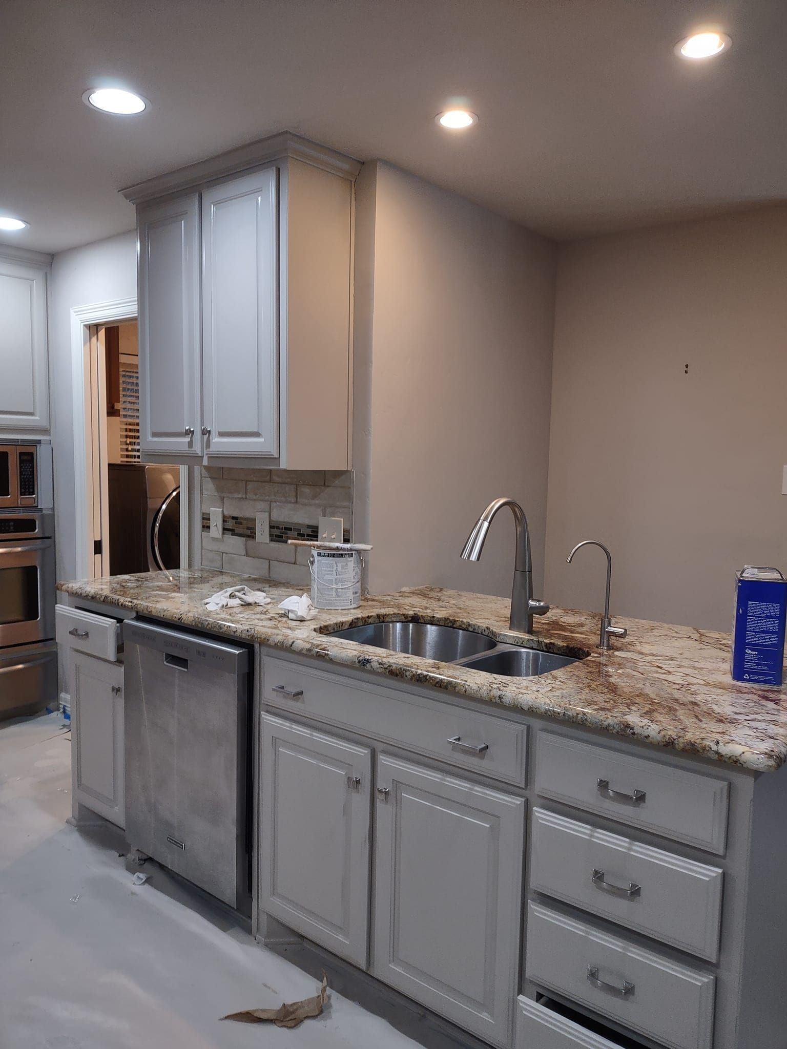 A kitchen with stainless steel appliances and granite counter tops