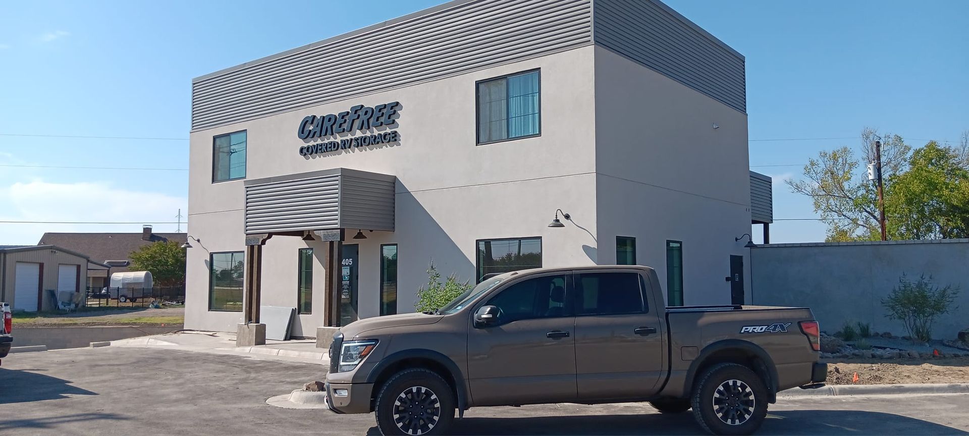 A truck is parked in front of a building.