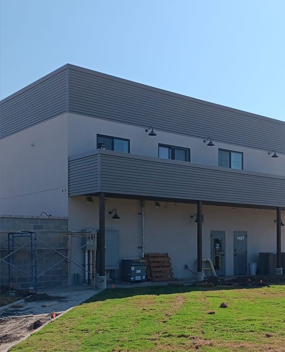 A large building with a balcony and a lot of windows
