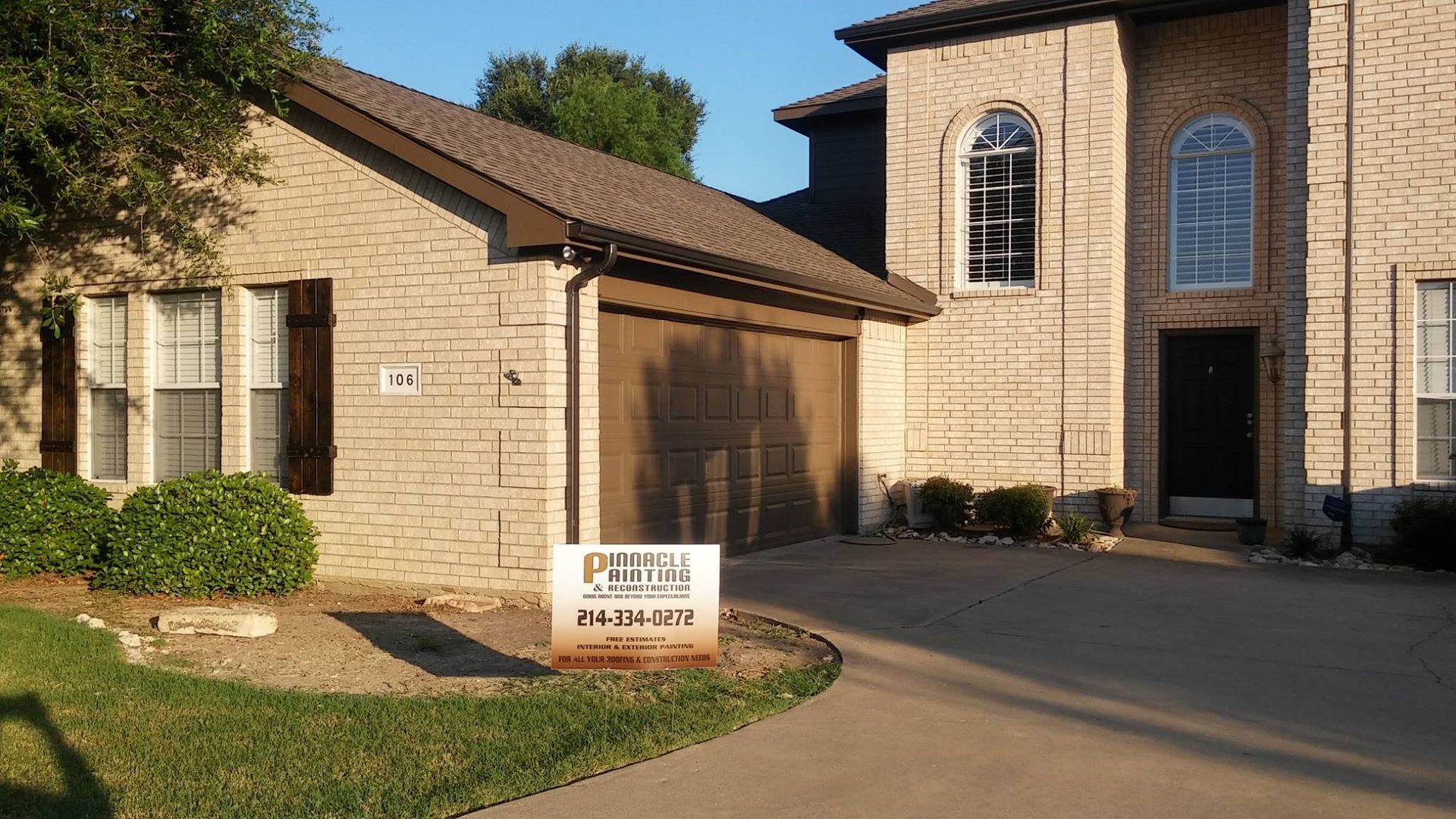 A house with a sign in front of it that says ' for sale '
