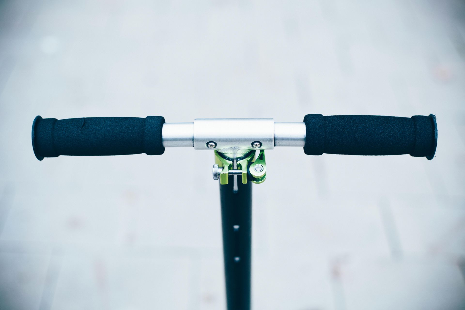 A close up of the handlebars of a scooter