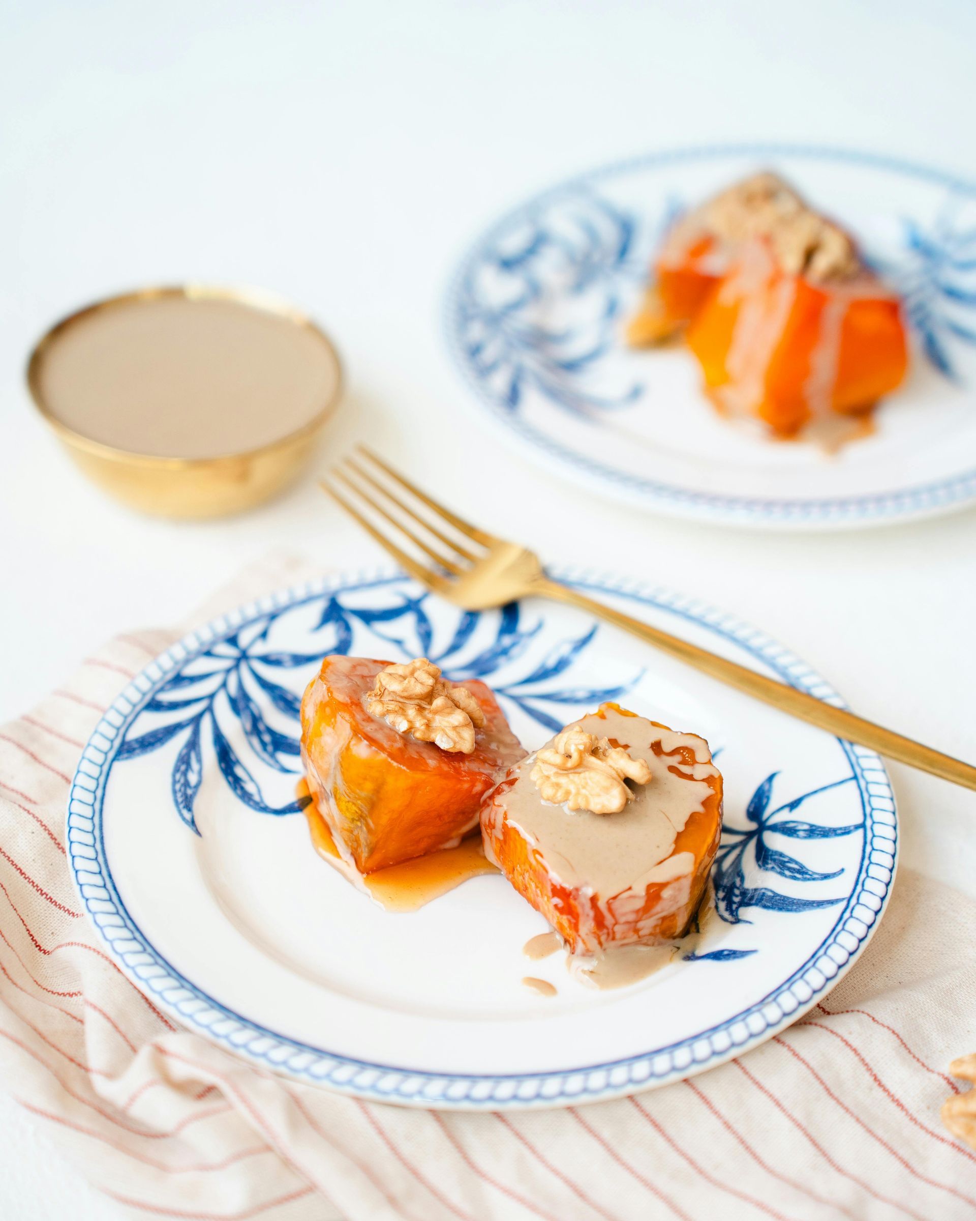 A plate of food with a fork on a table