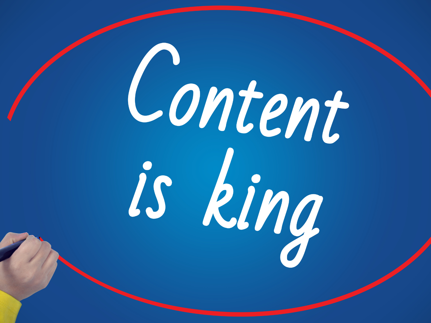 A person is writing the word content is king on a blue board.