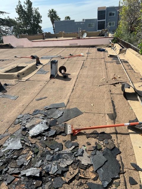 A roof that is being repaired with a broom
