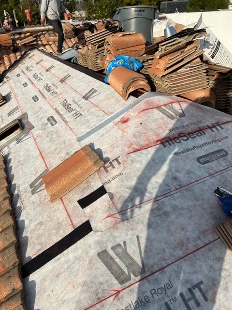 A roof with a lot of tiles on it that says ridge roof