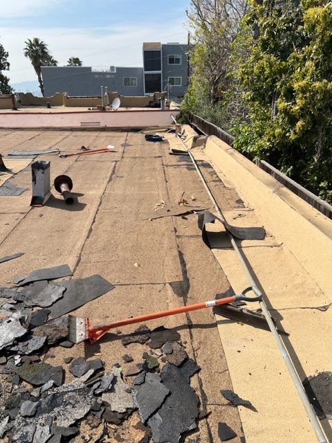 A roof with a few pieces of shingles on it