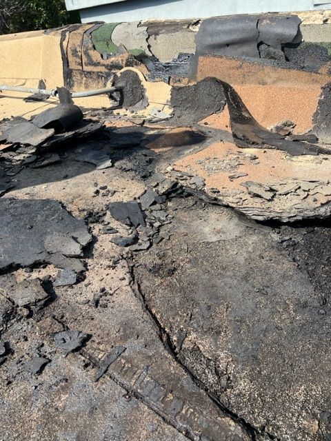 A roof with a lot of pieces of concrete on it