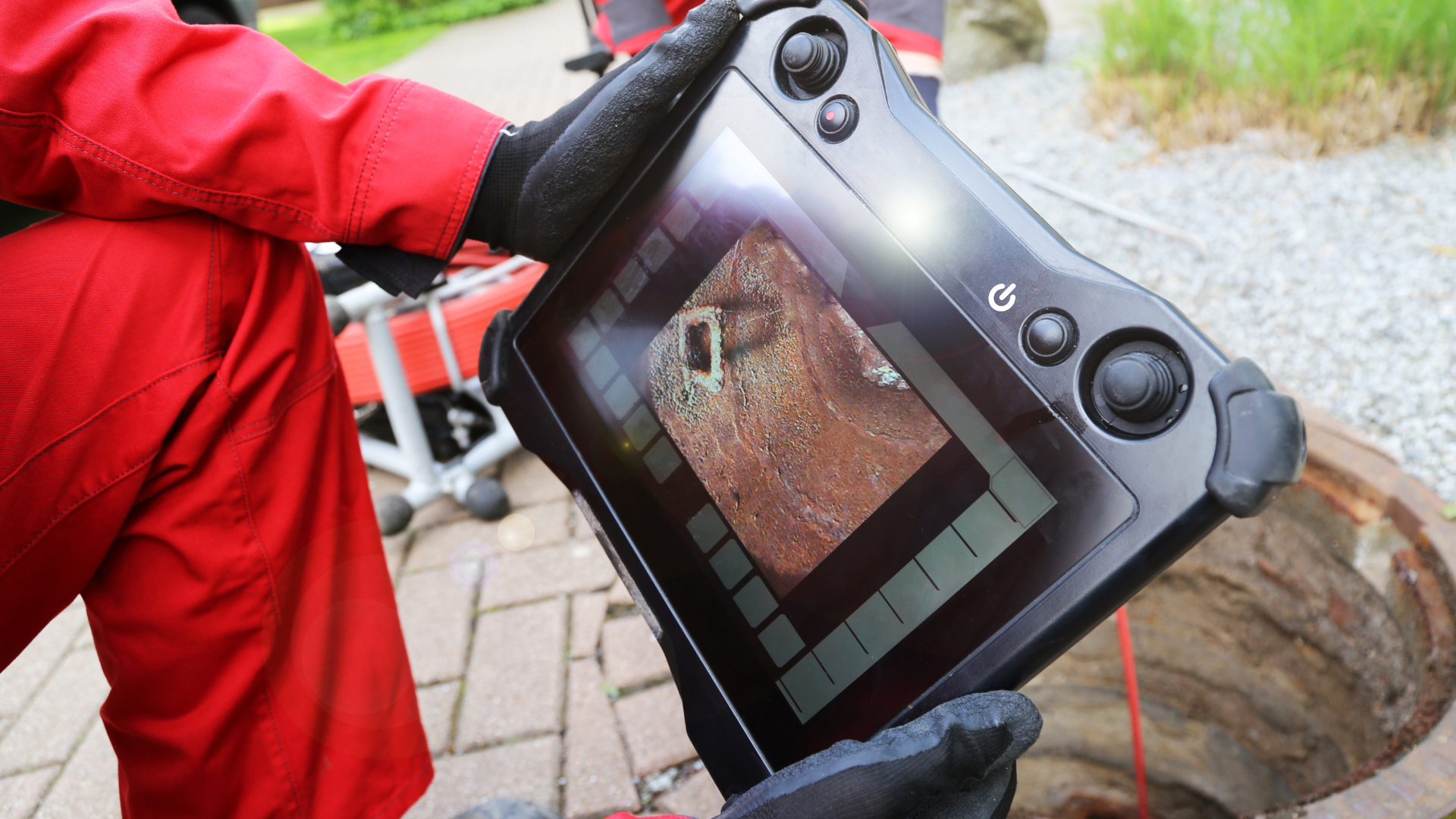 A person is holding a tablet in their hands.