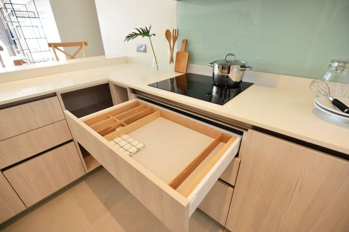modern kitchen opened wooden drawers