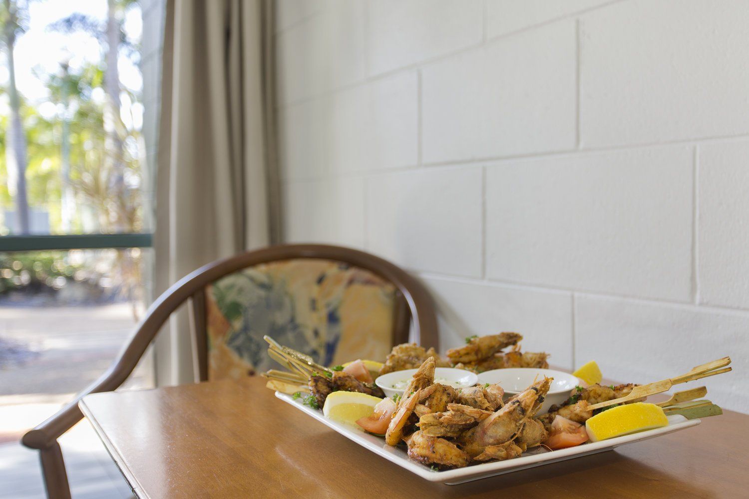 Fried Seafood Platter With Lemon — Capricorn Motel & Conference Centre In Parkhurst, QLD