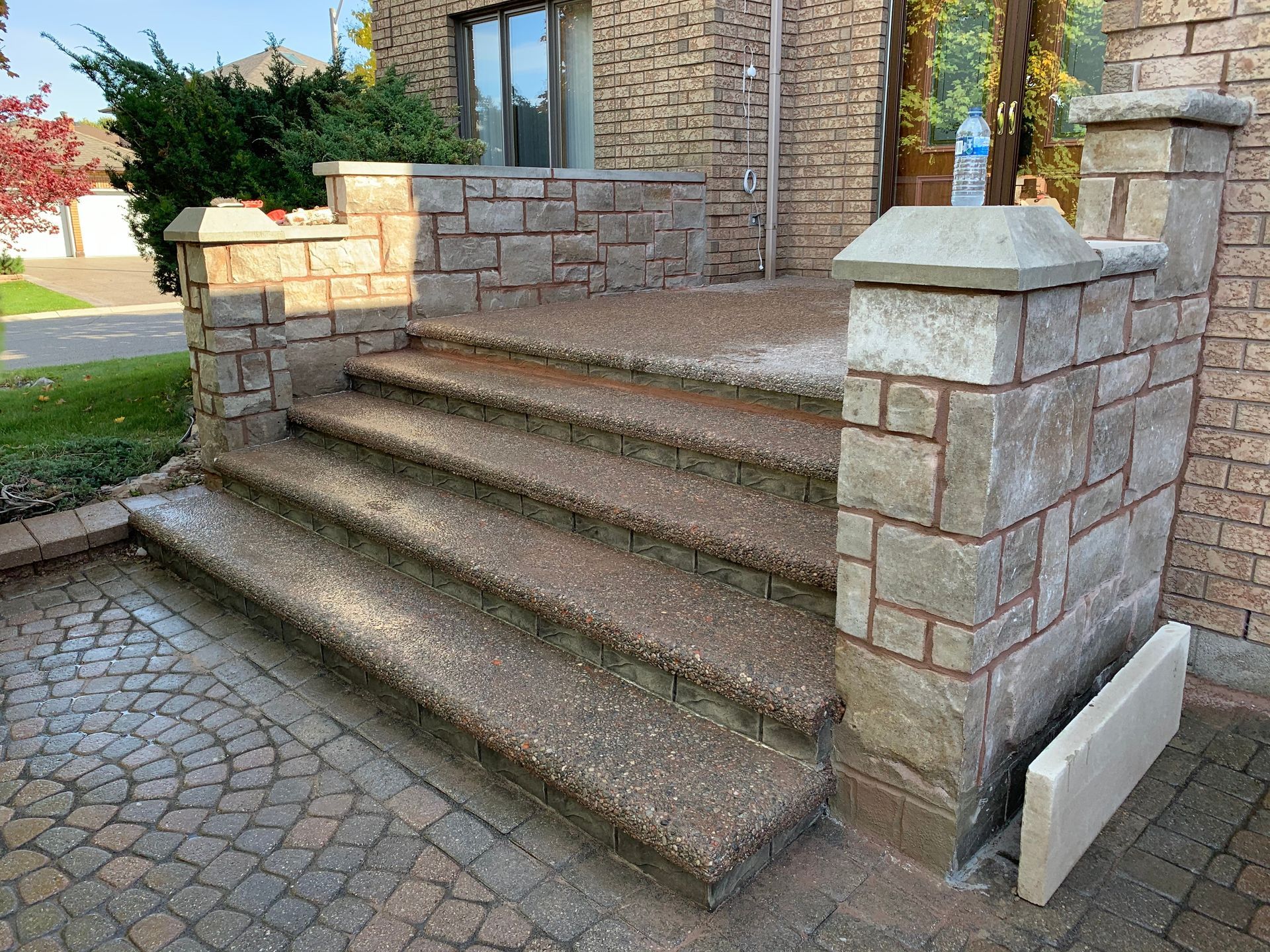 a set of stairs leading up to a brick building .