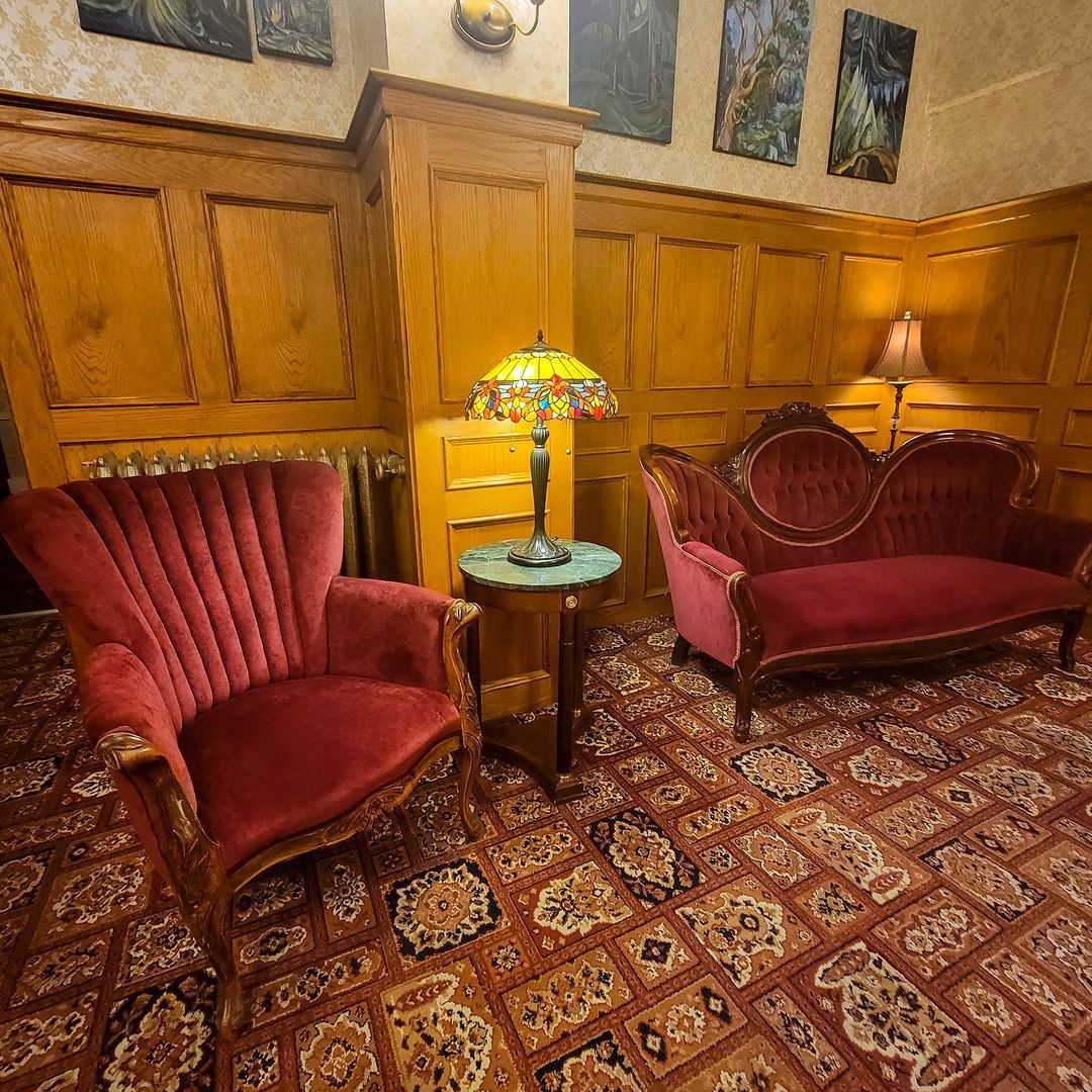 There are two chairs and a couch in the room.