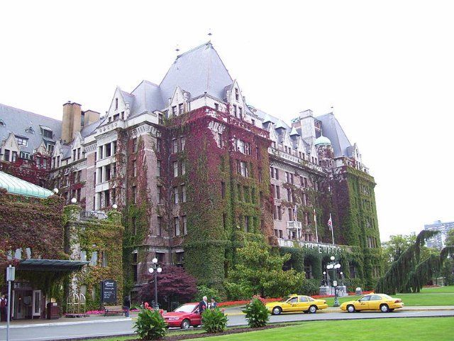 A large building with cars parked in front of it