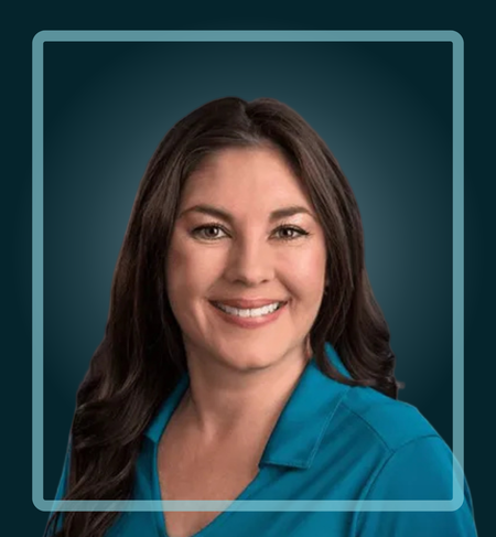 Woman with dark hair, smiling, wearing a blue shirt. Teal background with a blue border.