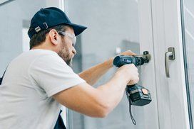 contractor replacing a door lock