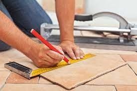 contractor remodelling a bathroom flooring