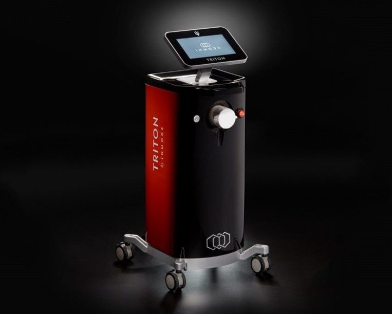 A black and red triton machine with a tablet on top of it