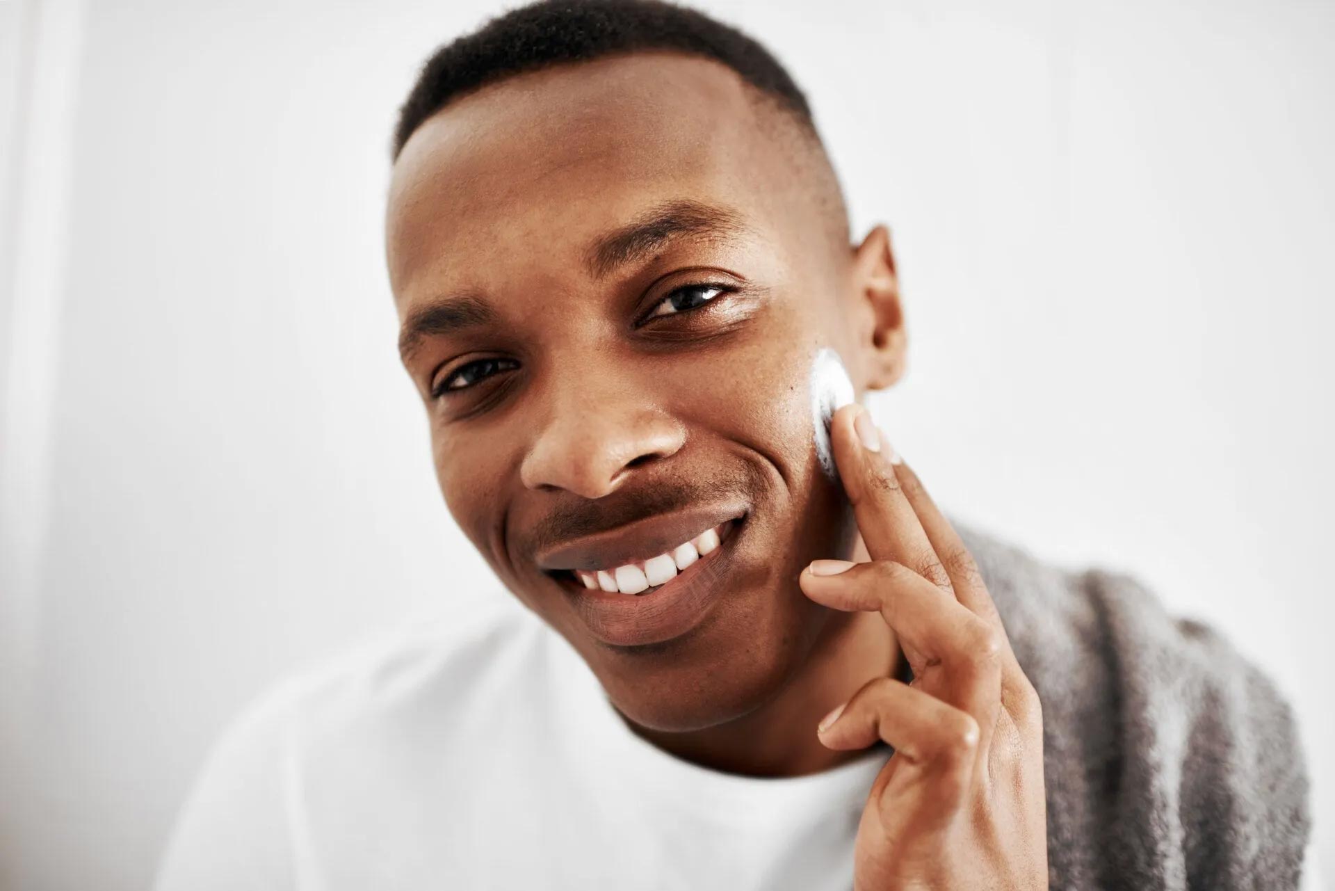 Man Putting Cream On His Face — Johnson City, TN — RNA Medical Aesthetics