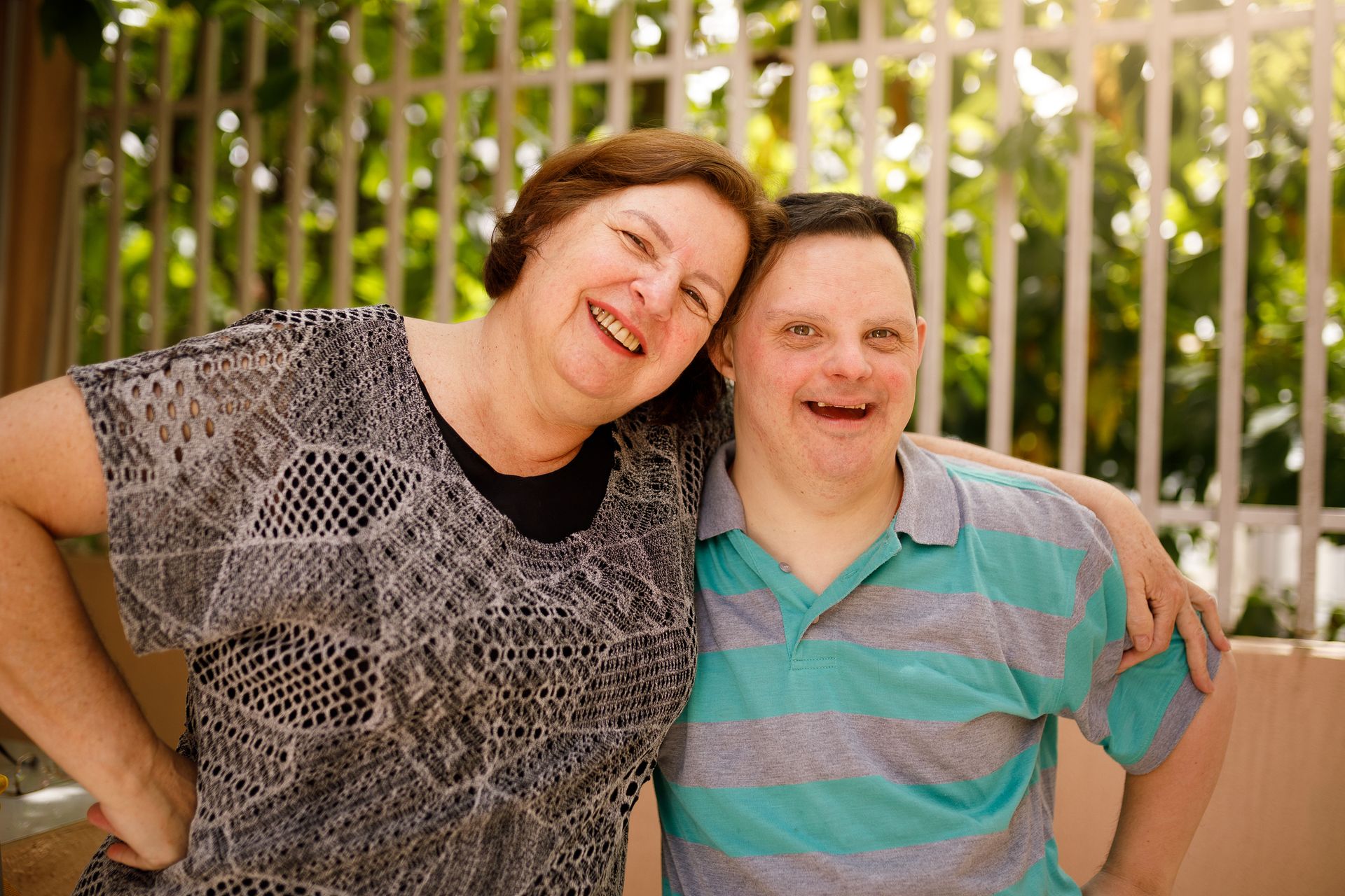 Caregiver and adult with special needs bonding.