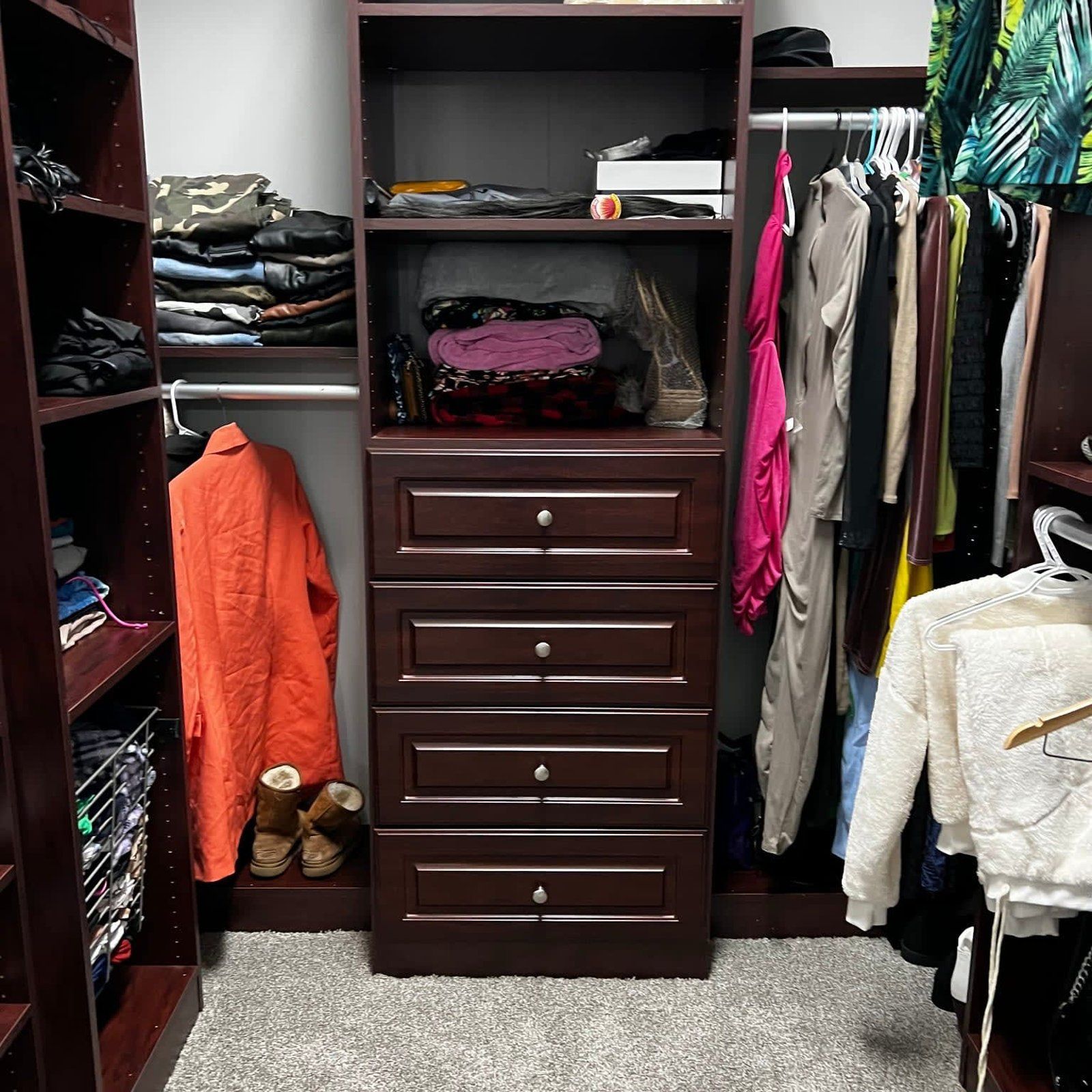 A closet filled with clothes and a purse