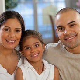 Hispanic family smiling - Preventative care in  Las Vegas, NV