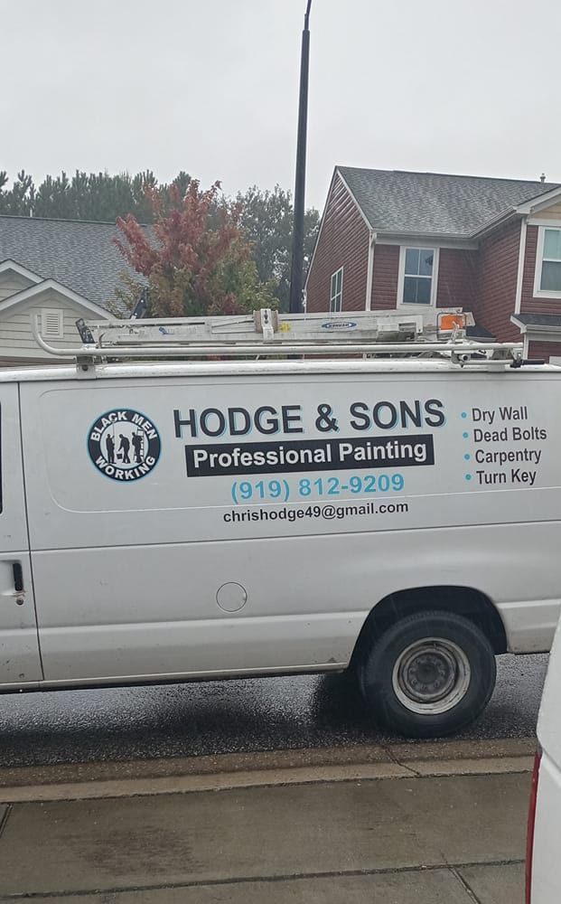 A white van is parked in front of a house.