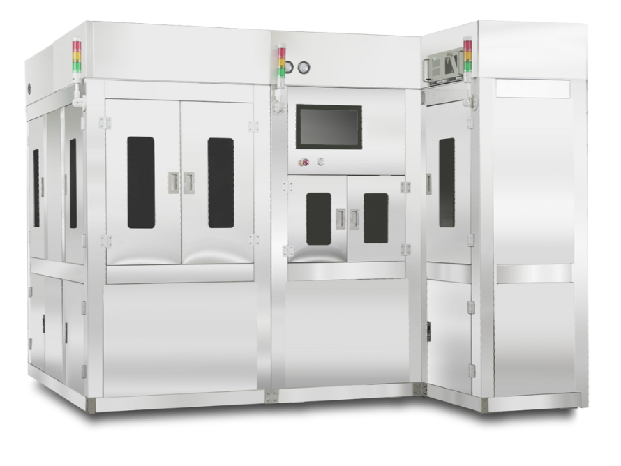 A large stainless steel machine is sitting on top of a white surface.