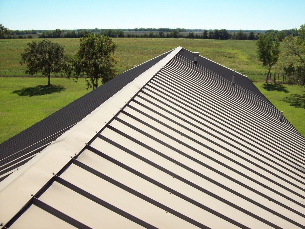 Metal Roof on a Building, Casting Linear Shadows Over the Panels — Darren Smith Roofing In Charlestown, NSW