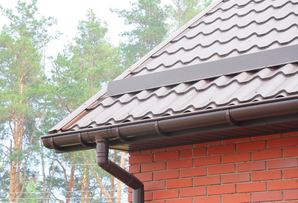 Brown Roof With Gutter and Downspout — Darren Smith Roofing in Glendale, NSW