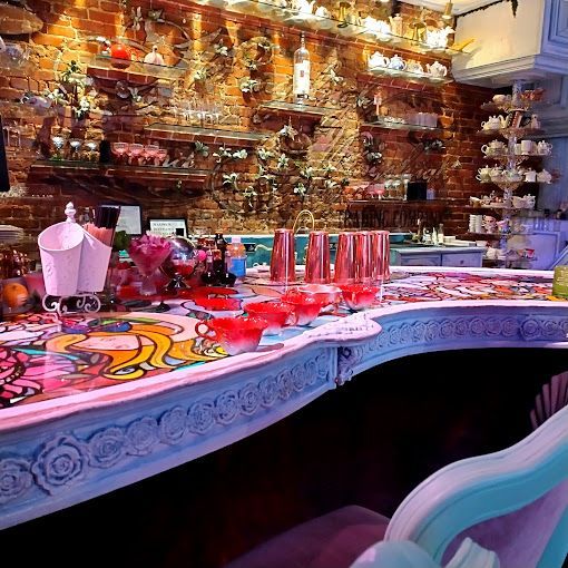 A bar with a lot of glasses and bowls on it