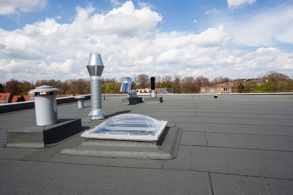 Stylish Inox Chimney atop a City Flat Roof — Quote Form in Gosford, NSW