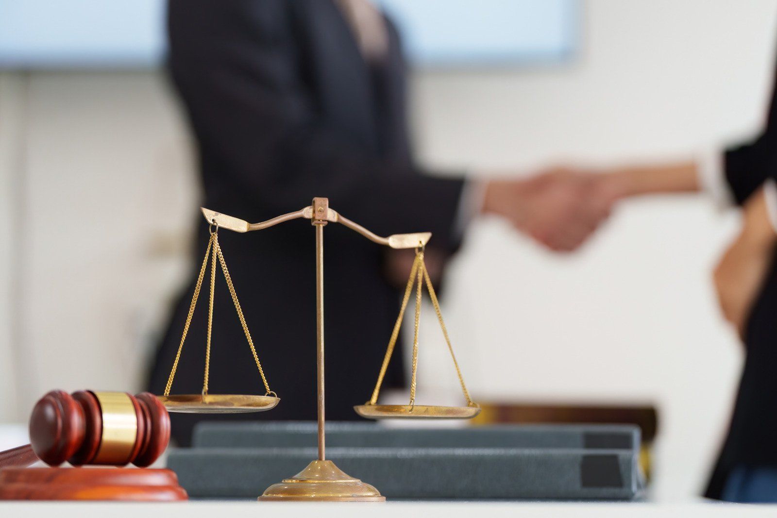 A man wearing a hard hat and goggles is standing in a room.