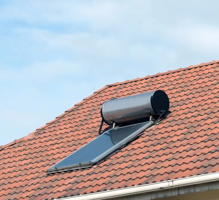 A Solar Hot Water System Installation On A Roof — Woodfire Heaters in Coffs Harbour, NSW